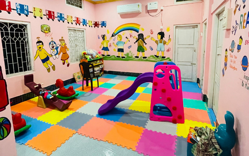 Vibrant classroom with colorful play area and educational decorations